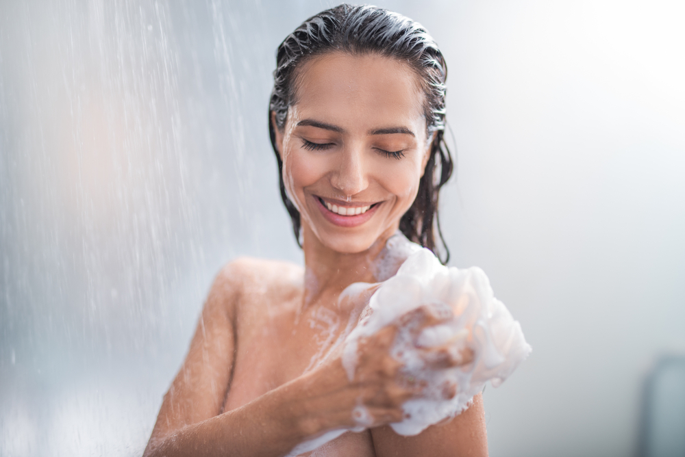 happy women in the shower covered in soap
